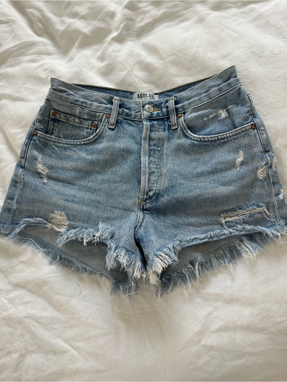AGOLDE Faded Light Blue Distressed Denim Cutoff Shorts